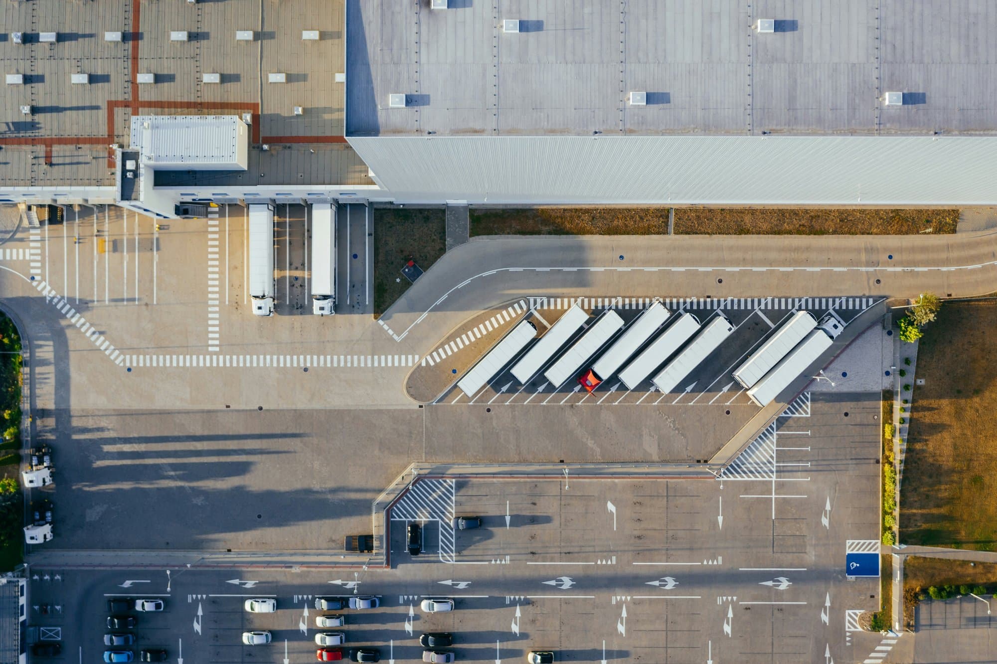 Aerial view of freight trucks at a distribution centre loading bay