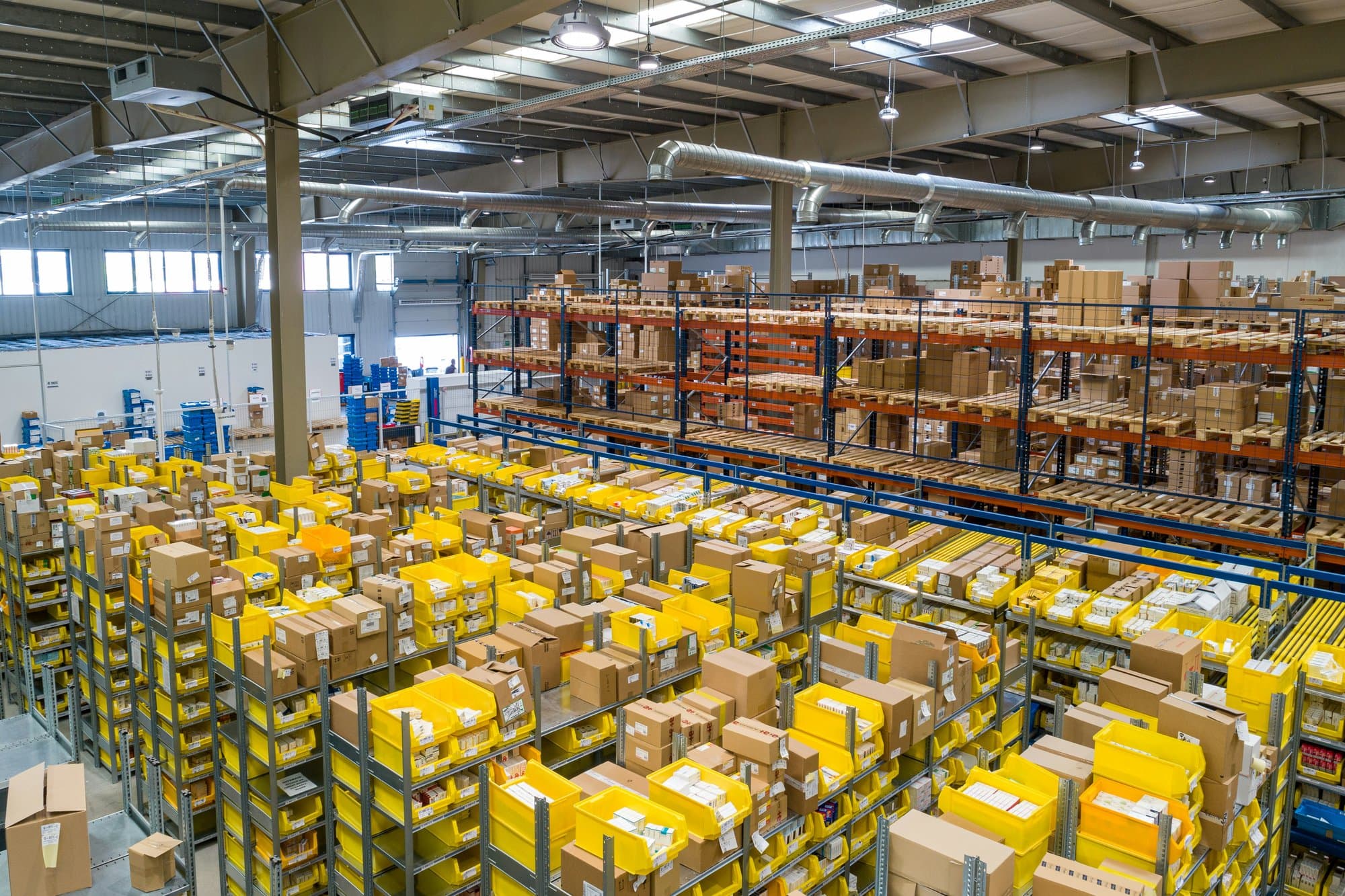 Warehouse pick faces with order bins in a fulfilment centre